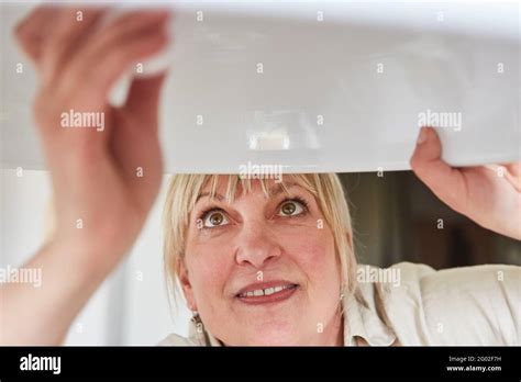 Woman led light bulb hi-res stock photography and images - Alamy