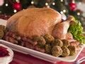 Crispy roast turkey with bacon rolls for dinner - Free Stock Image