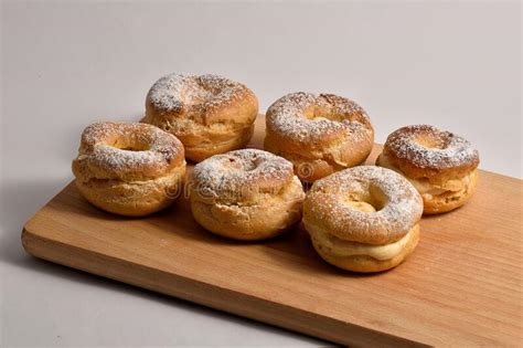 Variations of Six Sugared Sweets of the Sweet Puff Pastry Lying on a Wooden Board Stock Photo ...