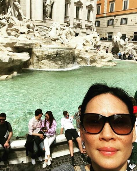 Lucy Liu taking a break with a selfie in Rome, Italy during the shooting of her episode of Luke ...
