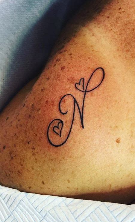 Letter N Tattoo | Tattoo lettering, Alphabet tattoo designs, Tasteful tattoos