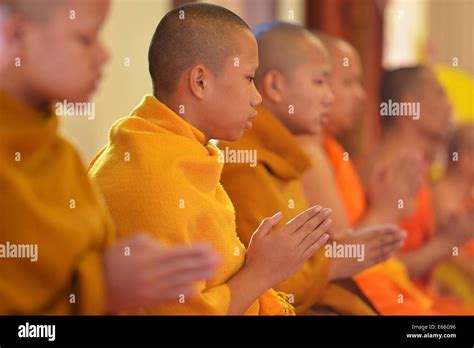 Chiang Mai, Thailand - February 15, 2014: Buddhist monks praying in a temple in Chiang Mai ...