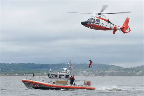 Coast Guard Helicopter Rescues 3 Commercial Fishermen | Military.com