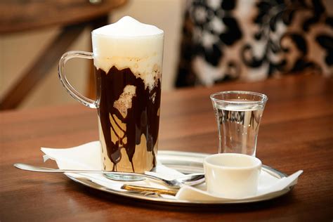 Hot coffee with whipped cream in a tall glass 1986951 Stock Photo at ...