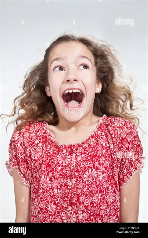 Girl with mouth open Stock Photo - Alamy