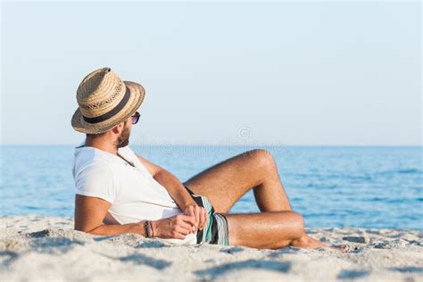 Young Man Lying on the Beach Stock Photo - Image of beautiful, portrait: 97898314