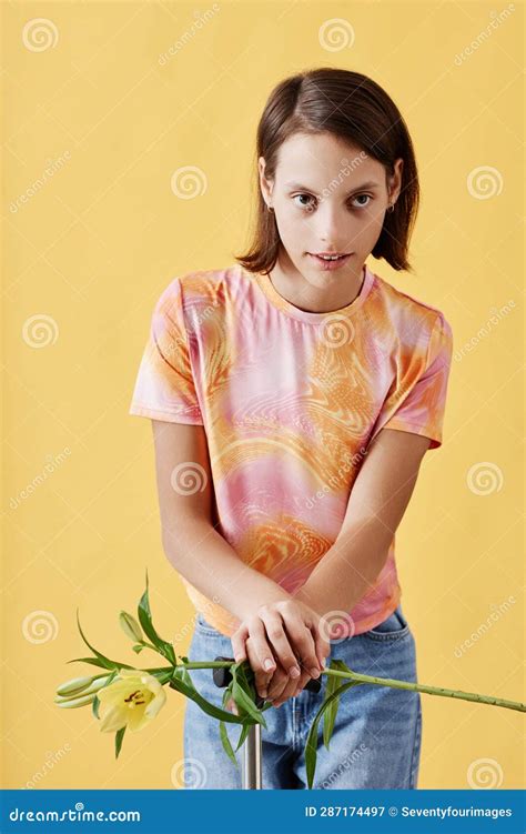 Girl with Cerebral Palsy Holding Lily Flower and Looking at Camera Stock Image - Image of girl ...