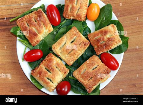 French pastry with spinach. Stuffed puff pastry. A tasty snack. Puff pastry with vegetables ...