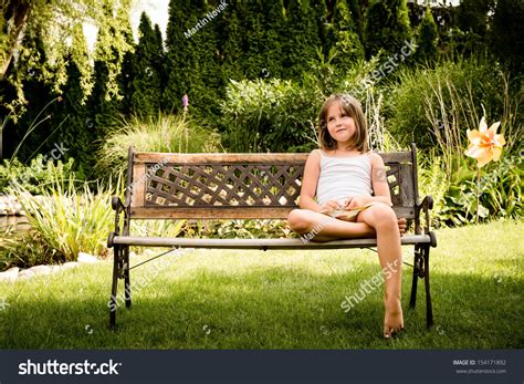 Daydreaming Child Portrait - Little Girl Sitting On Bench Outdoor In Backyard Stock Photo ...