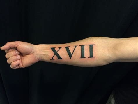 Roman Numerals on arm Artist: Nina Dreamworx Ink 3883 Rutherford Rd, Unit 11 Vaughan, ON L4L 9R8 ...