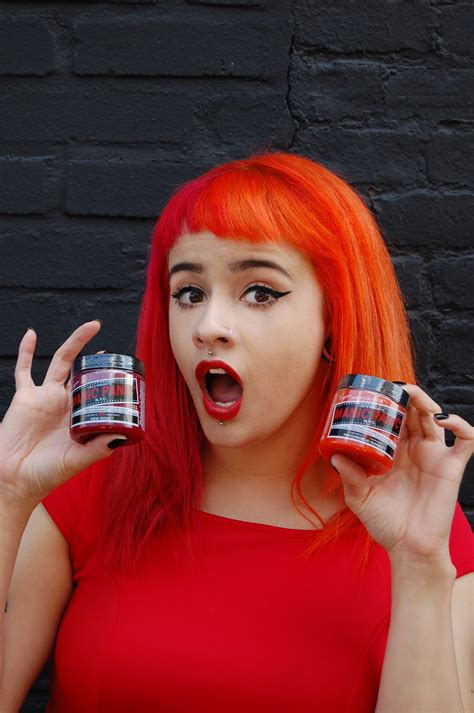 Cassie outside our offices, showing off her latest dye "recipe," red on the left and our new ...