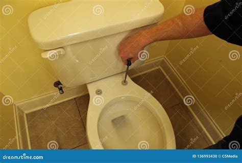 Hand Repairing Broken Toilet Seat Stock Photo - Image of hands, install: 136993430