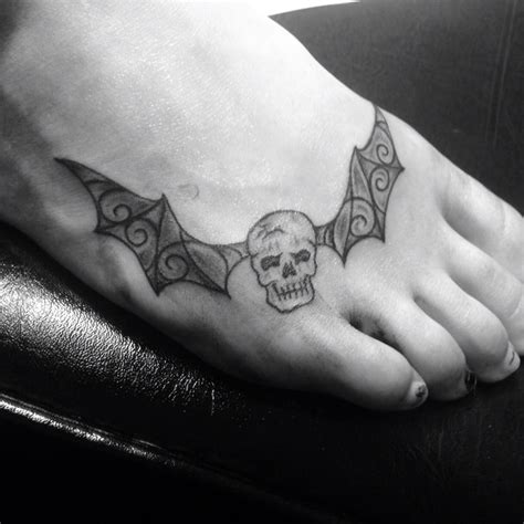 Skull tattoo with bat wings on my foot! | Tattoos, Tattoo magazines, Skull tattoo