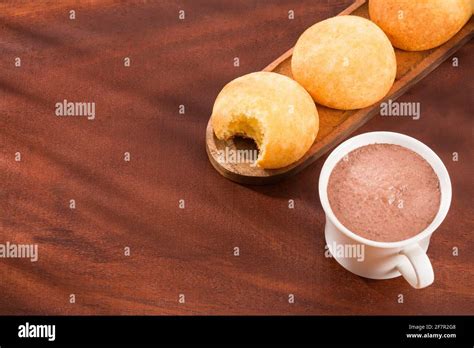 Almojabana, traditional Colombian food - Drink of chocolate Stock Photo - Alamy