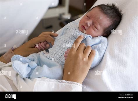 1 day old newborn with mother Stock Photo - Alamy