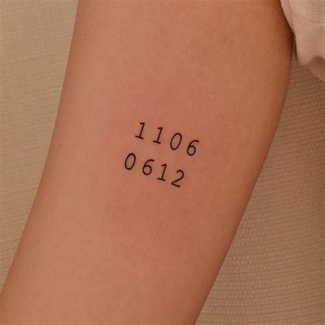 Numbers tattoo on the inner arm.