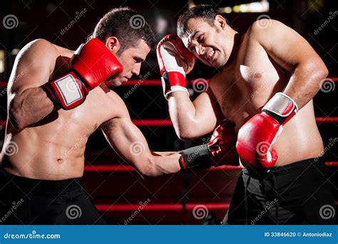 Throwing a Hook on a Boxing Fight Stock Photo - Image of fight, competition: 33846620