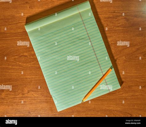 Top view of lined open sideways notebook with pencil on it, on wooden desktop background Stock ...