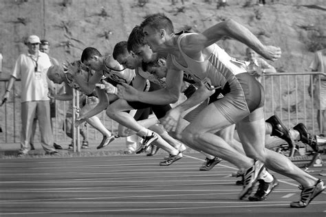 Athletes Running on Track and Field Oval in Grayscale Photography · Free Stock Photo
