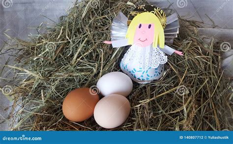 Eggs in a Nest with an Angel Figure. Happy Easter Stock Photo - Image ...