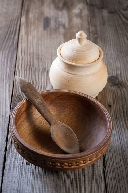 Premium Photo | Wooden spoon on a wooden bowl