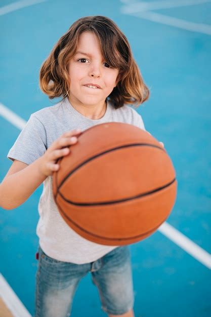 Free Photo | Medium shot of boy playing basketball