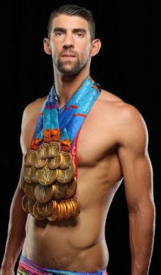 Michael Phelps wears all his 23 Gold Medals for Sports Illustrated ...