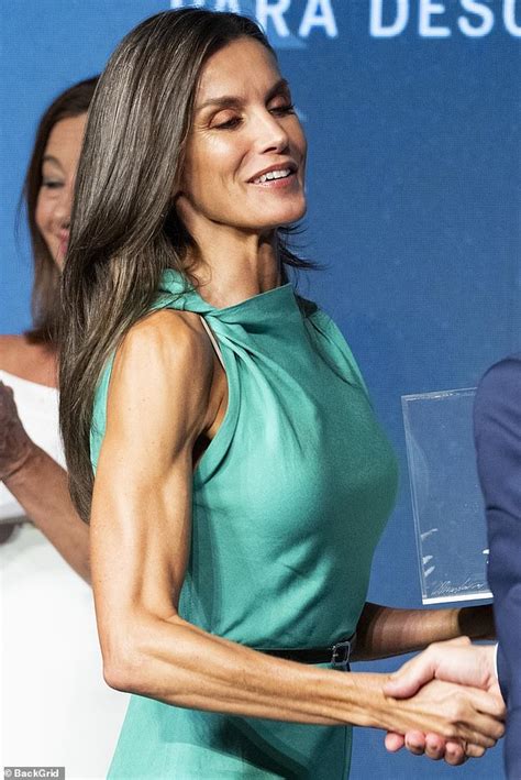 Queen Letizia of Spain displays her VERY toned arms in a turquoise ...