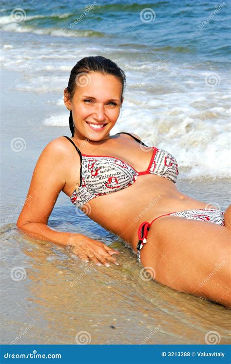 Women Lies On The Sea Beach Stock Photo - Image: 3213288