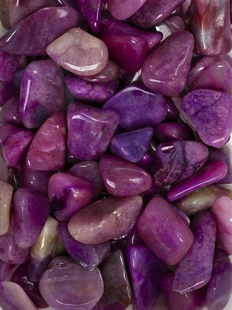 purple rocks are stacked on top of each other