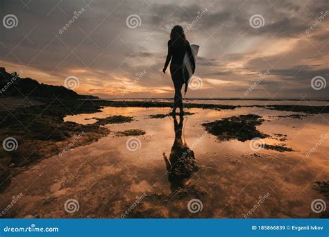 Surf Girl Meets Sunset on the Beach. Silhouette Stock Image - Image of ...