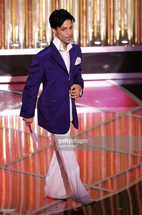 Singer Prince presents the awards for best original song during the ...