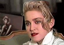Madonna Putting On Glasses GIF - Madonna Putting On Glasses Eyeglasses - Discover & Share GIFs