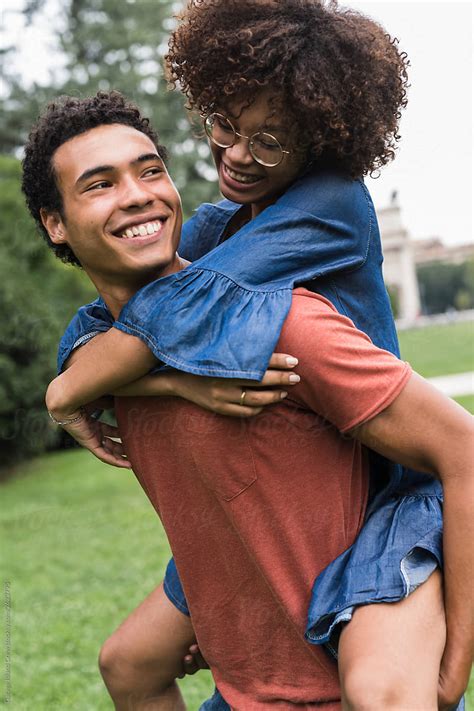 Happy young black couple in the park - Stock Image - Everypixel