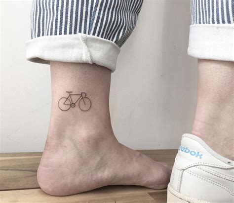 Minimalist Tiny Bicycle Tattoo by Vivien Szincsak