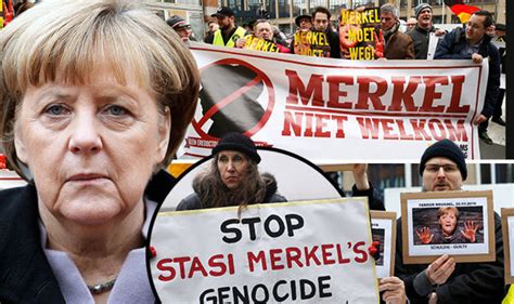 Angela Merkel protests - Anger as German chancellor receives honorary ...