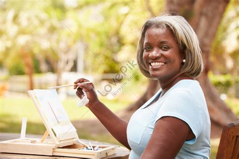 A Senior Woman Sitting At An Outdoor Table Painting A Landscape Picture And HD Photos | Free ...
