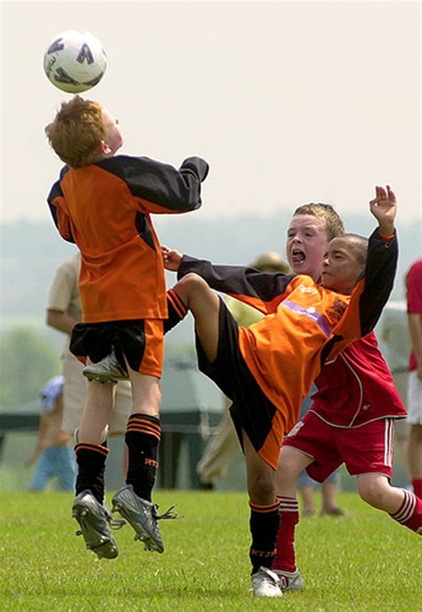 Kid getting kicked in the nuts while headbutting a soccer ball : photoshopbattles