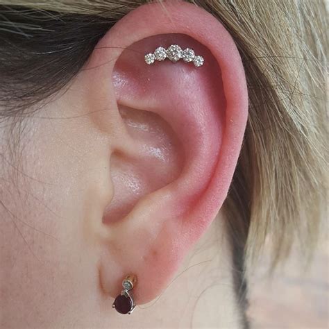 Helix Piercing [50 Ideas]: Pain Level, Healing Time, Cost, Experience - Piercee