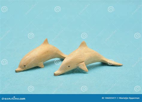 Two Wooden Dolphin Figurines Stock Image - Image of ornament, object: 106023411