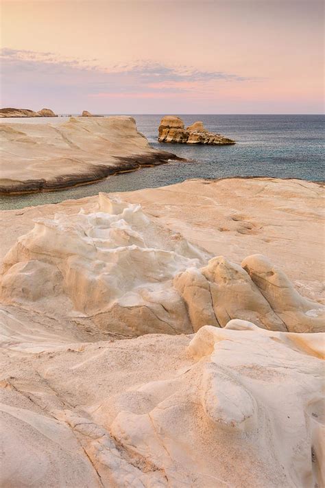 Volcanic Rock Formations On Sarakiniko Beach On Milos Island, Greece. Photograph by Cavan Images ...