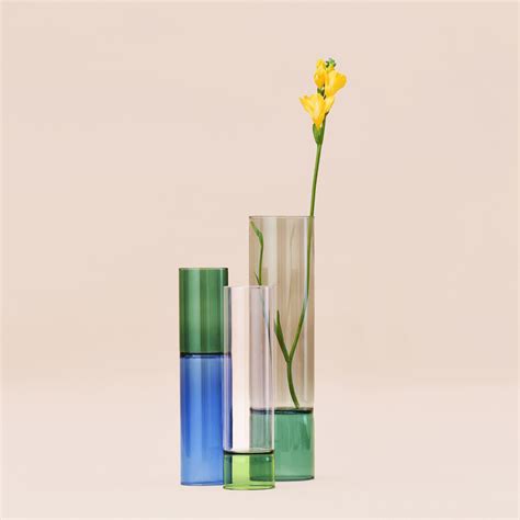 Bamboo Grove is a collection of mouth-blown glass vases that can be overturned and filled with ...