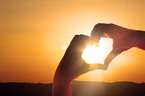 Hand Shaped Heart Against Sunset Stock Photo - Download Image Now - iStock