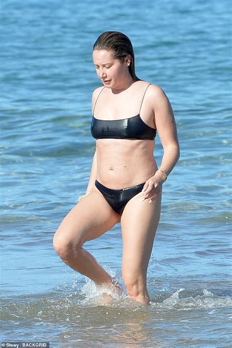 Ashley Tisdale sizzles in cheeky bikini as she splashes in the surf ...