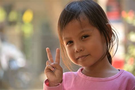 1440x2960px | free download | HD wallpaper: girl doing peace sign hand gesture, child, people ...