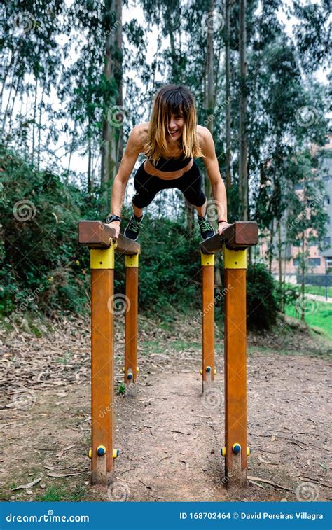 Athlete Woman Training on Parallel Bars Stock Photo - Image of smiling ...