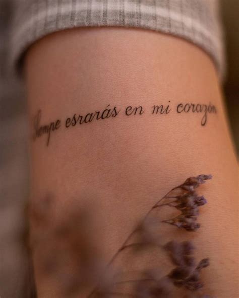 "Siempre estarás en mi corazón" lettering tattoo on