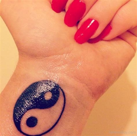 Beautiful Yin Yang Tattoo On Wrist | Tattoo Designs, Tattoo Pictures