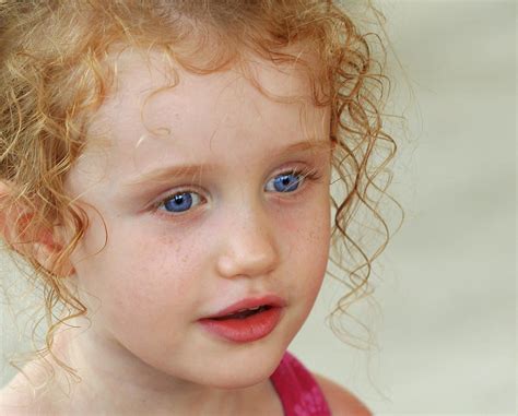 A Little Girl with Big Blue Eyes Photograph by Derrick Neill - Pixels