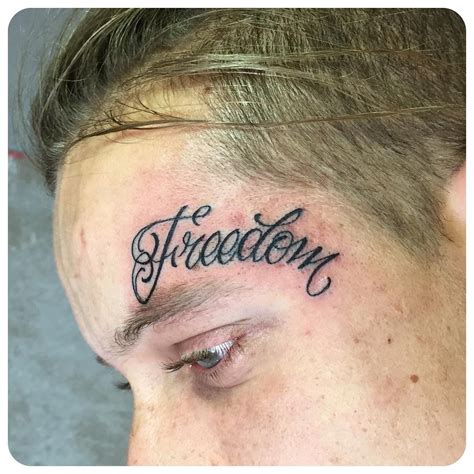 Freedom Lettering Tattoo on Face - Best Tattoo Ideas Gallery